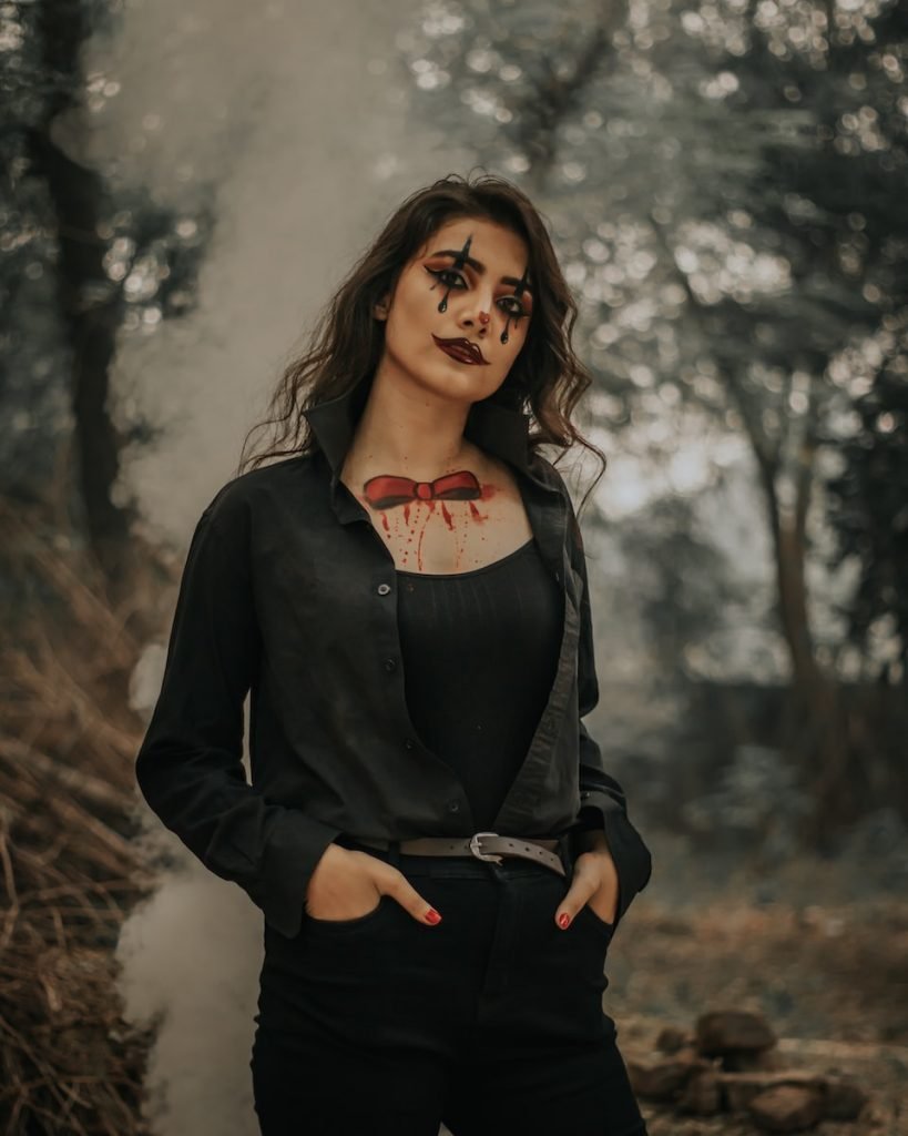 standing woman wearing Halloween makeup