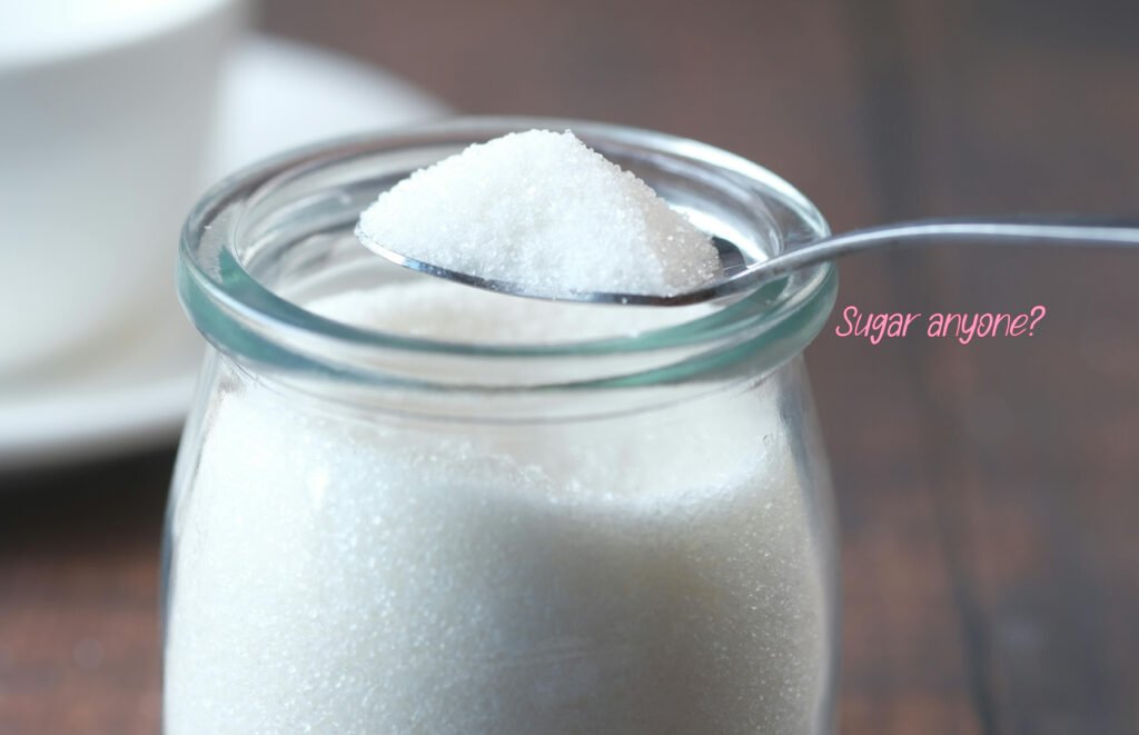 jar of sugar with a spoon