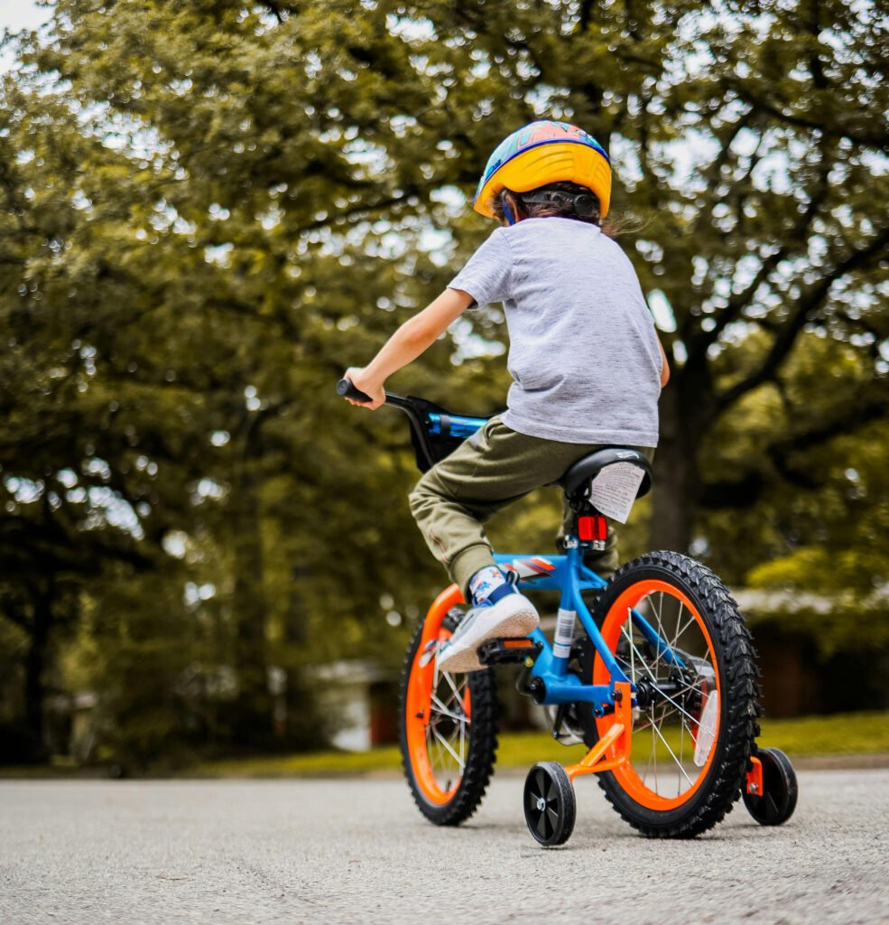 small child learning to ride a bike